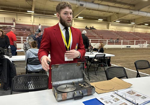 Ayden Kaps displays his welding sculpture at the Nebraska SkillsUSA Leadership Conference.